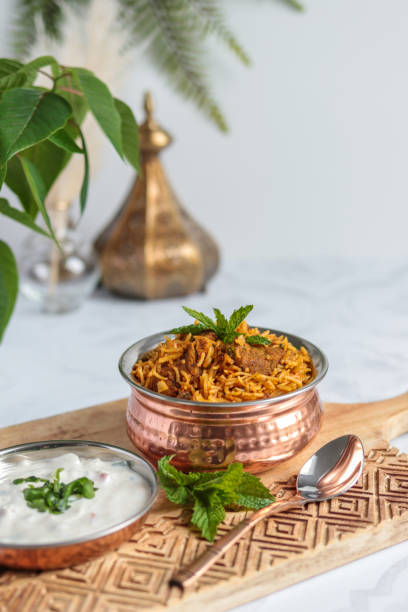 istock Traditional Lamb Biriyani mutton with yogurt dip raita 1328733875