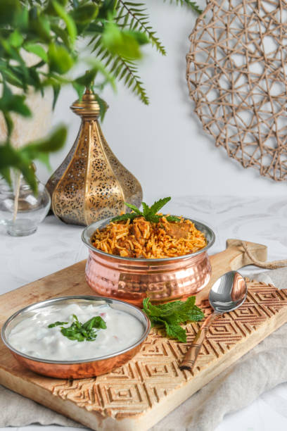 istock Traditional Lamb Biriyani mutton with yogurt dip raita 1328733893