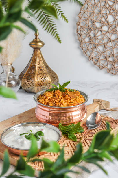 istock Traditional Lamb Biriyani mutton with yogurt dip raita 1328733899