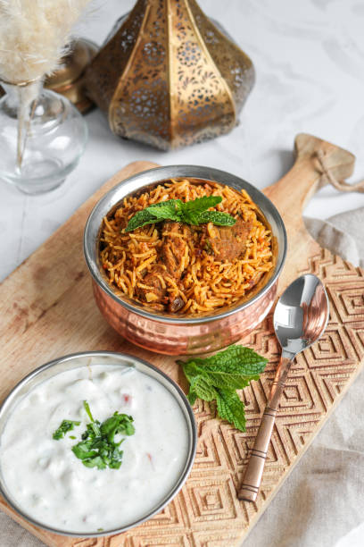 istock Traditional Lamb Biriyani mutton with yogurt dip raita 1328733902
