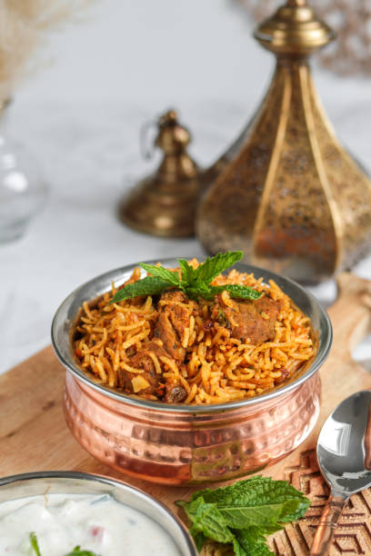 istock Traditional Lamb Biriyani mutton with yogurt dip raita 1328733904