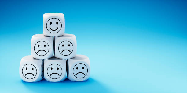 istock Stack of dice with smiling face icons 1328733988
