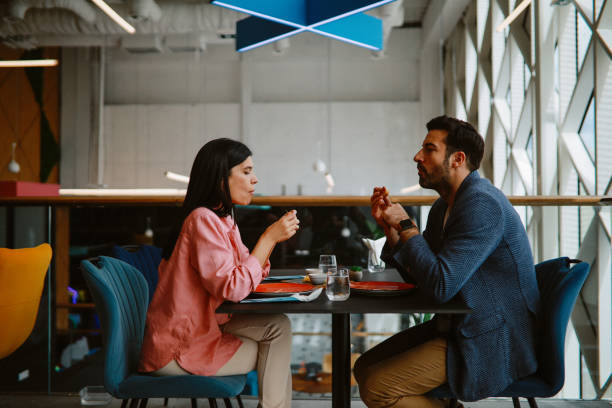 istock Young couple in the burger restaurant 1328736003