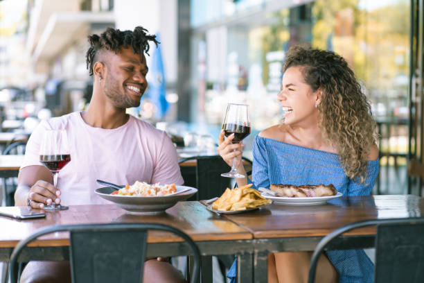 istock Young couple having a date at a restaurant. 1328739460
