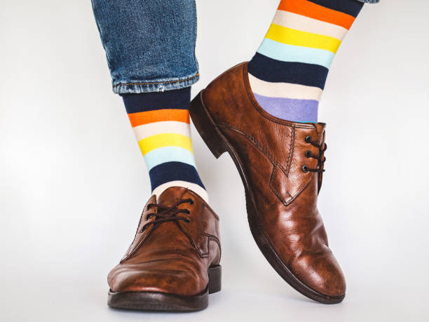 istock Men's legs, trendy shoes and bright socks 1328741663