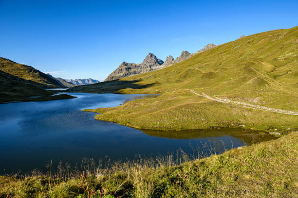 istock Beautiful small lake in the mountains 1328743766