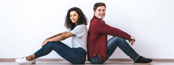 istock The attractive couple sitting on the floor 1328751082