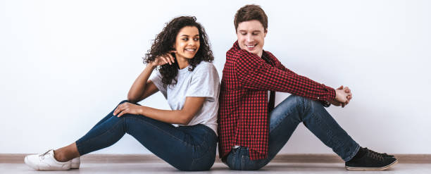 istock The attractive couple sitting on the floor 1328751093