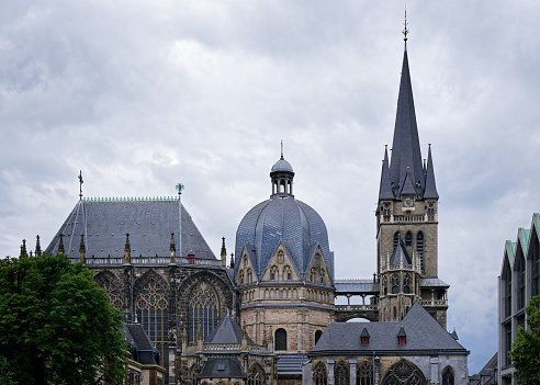 the aachen cathedral against an overcast sky