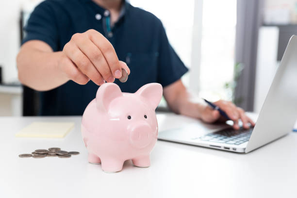 istock Saving money with piggy bank concept 1328753485