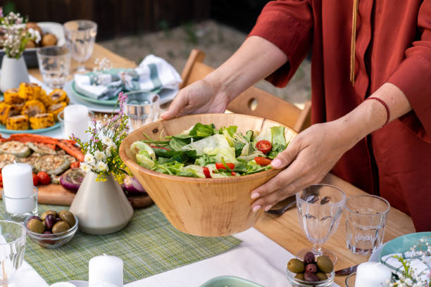 istock Woman Serving Salad 1328754175