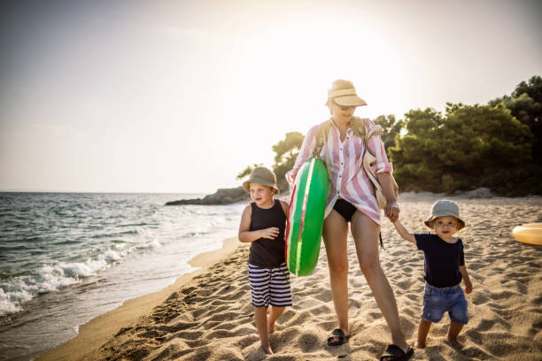 istock Mum and her boys at the Beach 1328754393