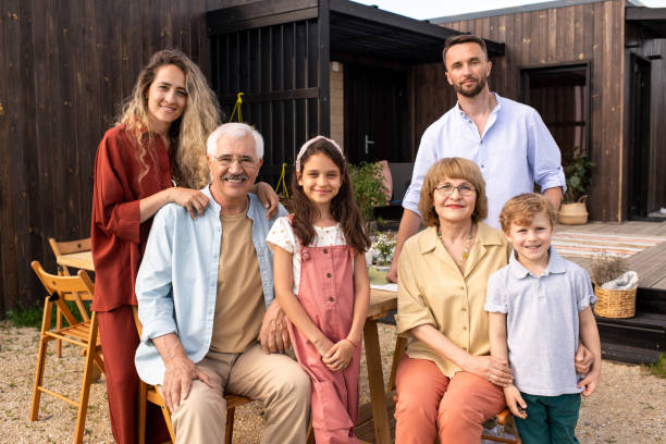 istock Big Family Standing in Backyard 1328754494