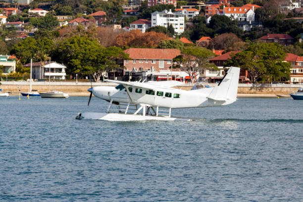istock Seaplane landing in city harbour, background with copy space 1328755983