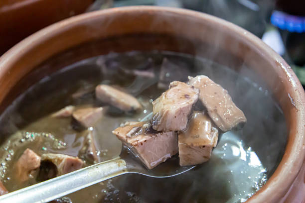 istock Ceramic pot with feijoada, typical Brazilian food. In a restaurant in Brazil. 1328756217