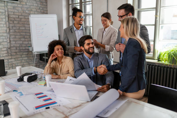 istock Multi-tasking business people working on a meeting in the office 1328757883