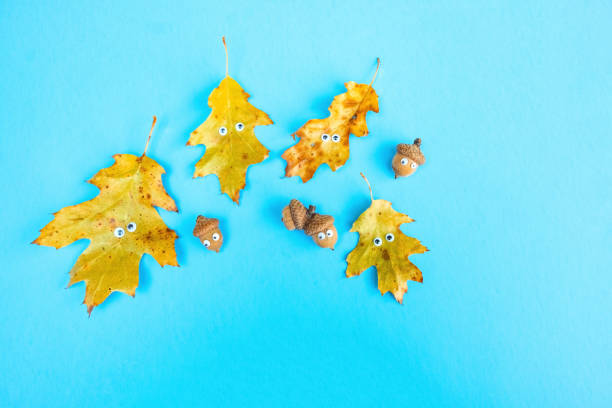 istock Funny Oak Leaf And Acorns with Leaf Funny Faces 1328758781