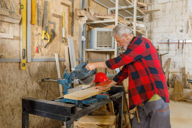 istock An Older Carpenter is Working on a Circular Saw in Carpentry Workshop. 1328759243