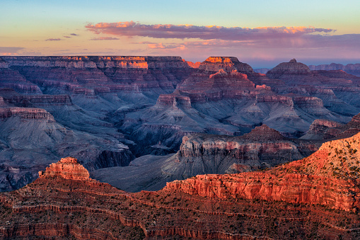 The last of the light from the summer sun washes over a blazing Grand Canyon.