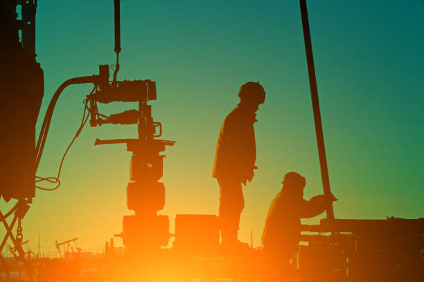istock Oil drilling exploration, the oil workers are working 1328763570