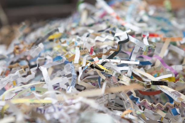 Selective focus Pile of recycled paper scraps for global warming concept Selective focus Pile of recycled paper scraps for global warming concept paper shredder stock pictures, royalty-free photos & images