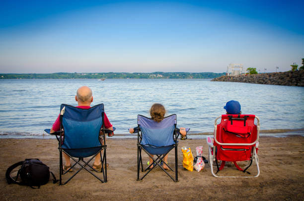 Father and children looking at St. Lawrence river
