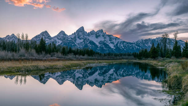 istock Grand Tetons sunset reflection in the Snake River 1328768521