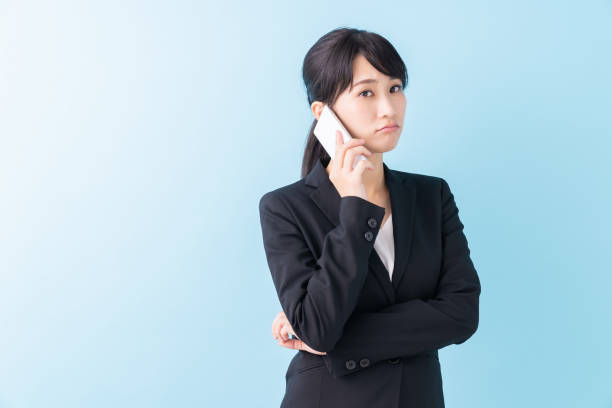 istock young asian woman who talks on the telephone,think, 1328775112