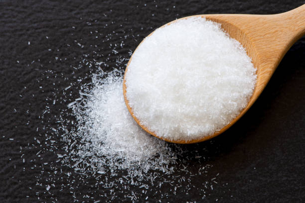 istock White sugar in wooden spoon 1328779138
