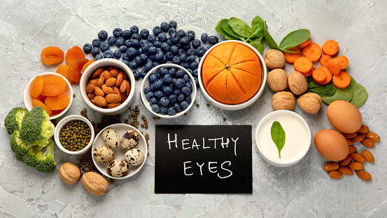 Food for eyes health. Foods that contain vitamins, nutrients, minerals and antioxidants. Top view, flat lay, copy space