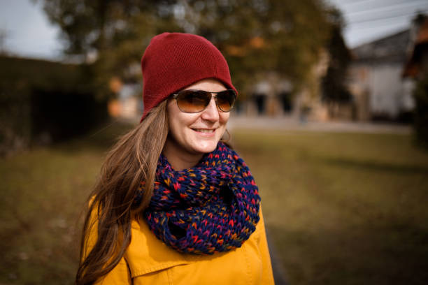 istock Woman wearing knit hat smiling 1328782682