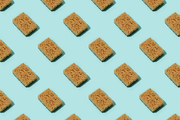 istock Seamless Pattern with neutral beige clean sponges for home cleaning on blue background. Banner for your site, concept for laundry, cleaning service, advertising, spring regular cleaning day 1328785681