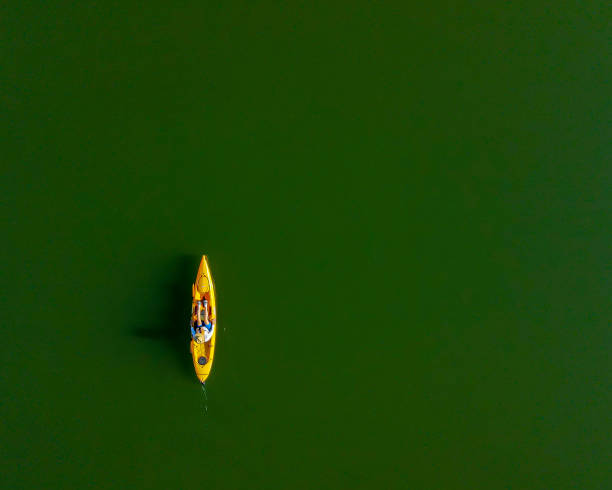 istock Kayaking on a calm lake in the morning 1328786868