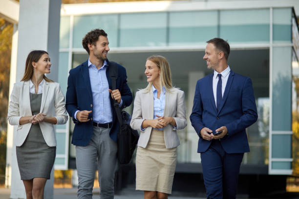 istock Four young executives talking on the street 1328787672