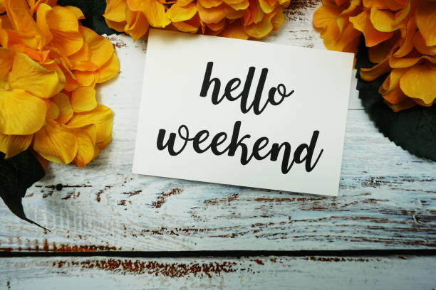 istock Hello Weekend Card with Blooming flower on wooden background 1328789413
