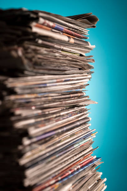 istock Pile of newspapers, studio shot. 1328793100