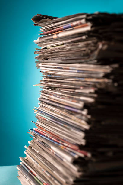 istock Pile of newspapers, studio shot. 1328793115