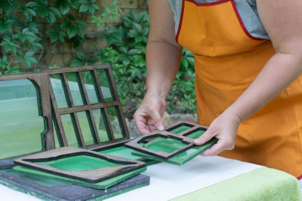 production of handmade paper sheets from waste paper at home. frames for pouring paper. secondary production, arts and crafts concept. - secondary action imagens e fotografias de stock