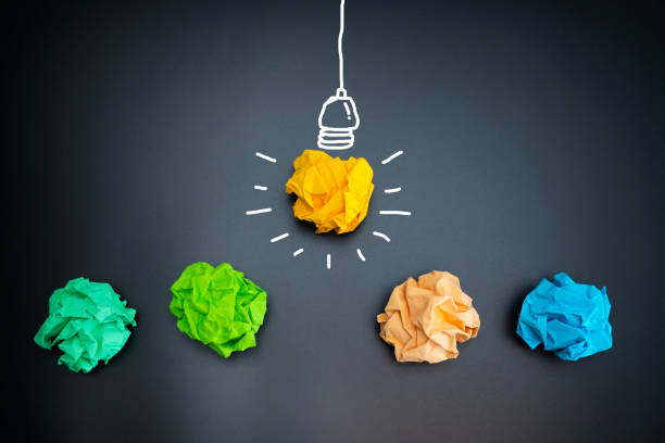 istock Paper Ball on Blackboard and lightbulb shape 1328795979