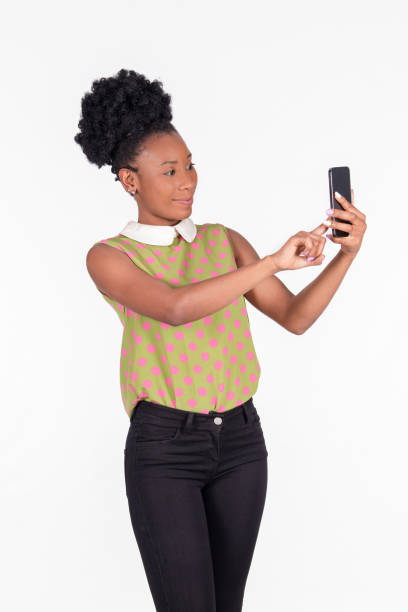 istock Surprised looking latina woman using her phone: Expressions and diversity concept. 1328796078