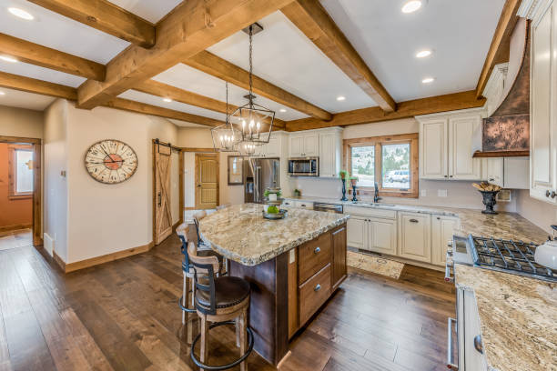 istock Massive wood beams on ceiling in new kitchen 1328796116