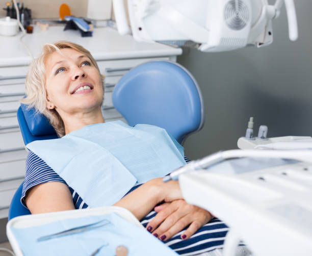 istock Woman in dentist office waiting for procedure 1328796958