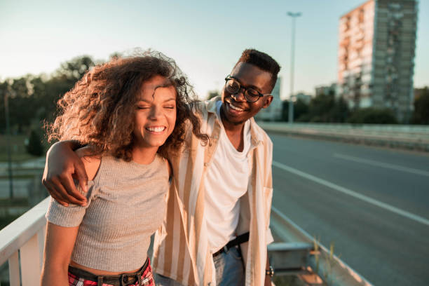 istock Happy black couple enjoying on a bridge. 1328805538