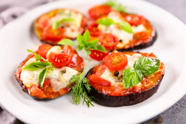 istock aubergine pizza with tomato sauce,  mozzarella and basil 1328806751