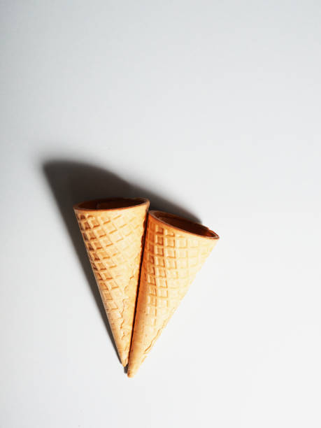 istock two waffle cups for ice cream on a colored background, minimalism style 1328806862