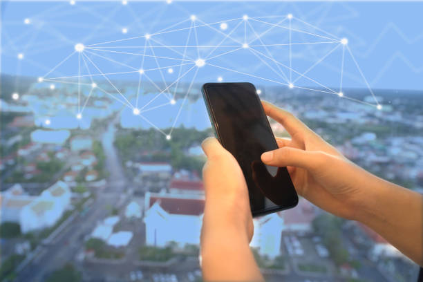 Hand used to touch a smartphone for internet communication and online trading.
