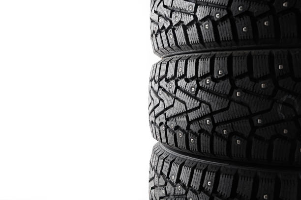 istock Three new wheels with spikes on a white background 1328808118