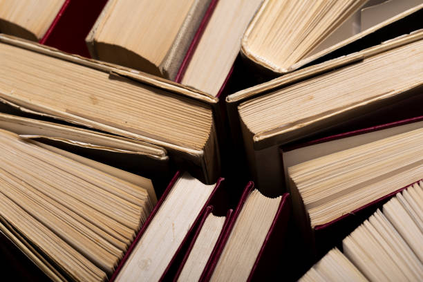 istock Background from old and used hardback books 1328809189