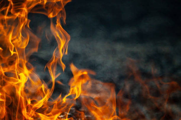 istock Dry grass is burning. Fire in the field in spring. 1328809314