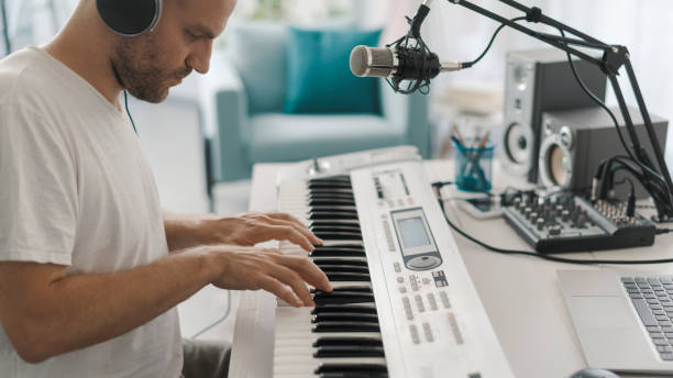 istock Professional musician composing music at home 1328815194